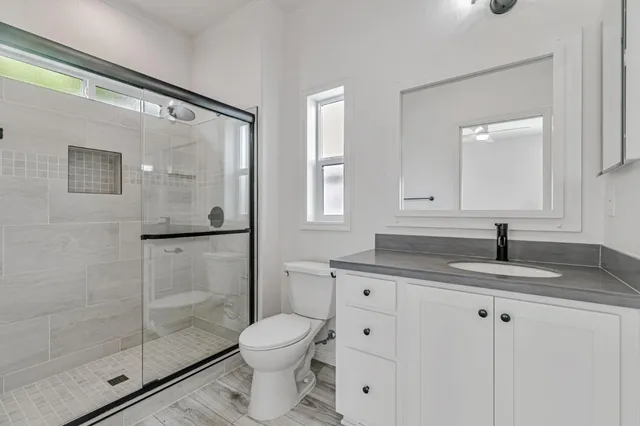 a bathroom with a shower and toilet