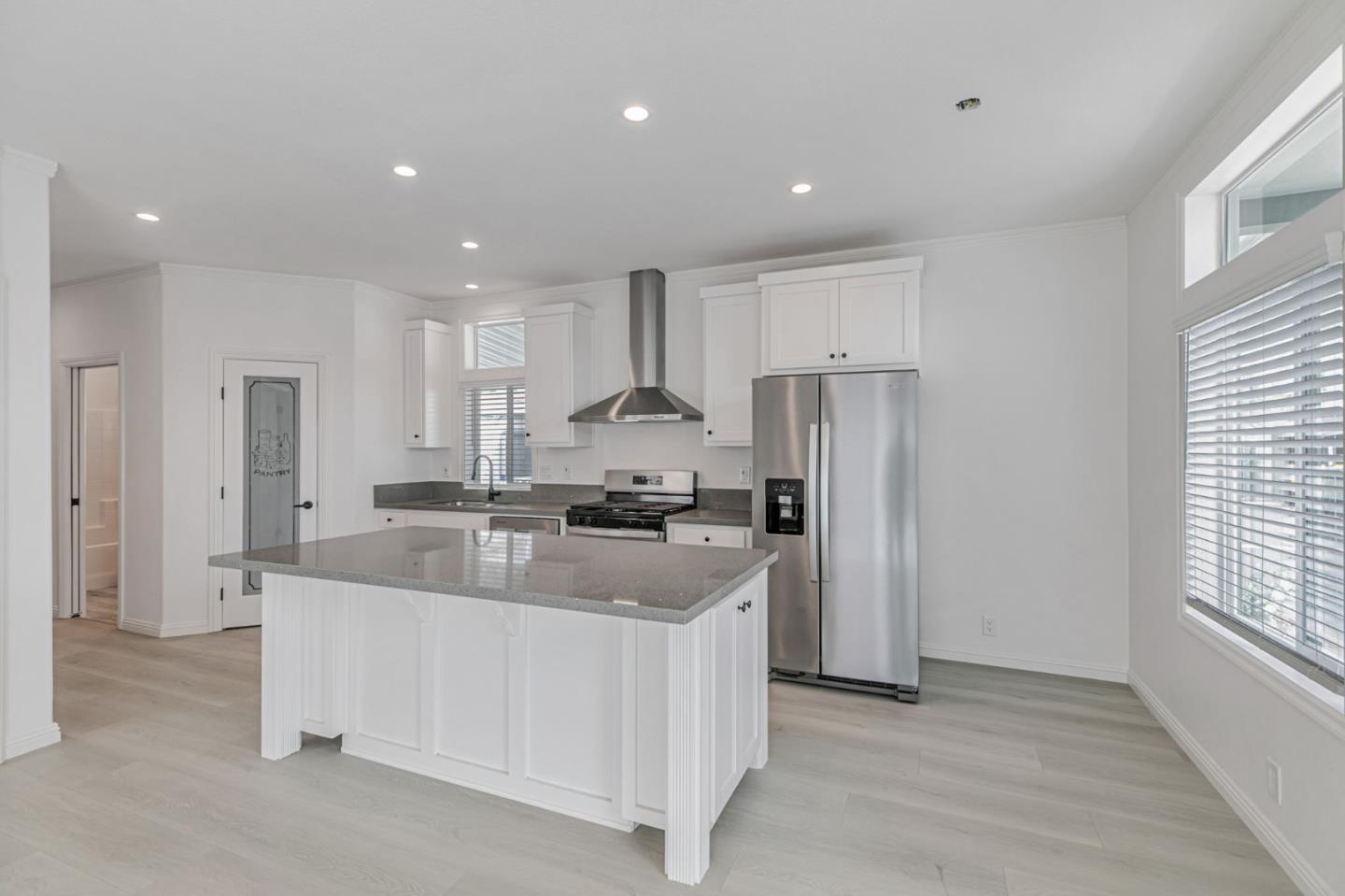 555 Umbarger Road, Unit 131 San Jose, CA 95111 - Photo 9 of 29 a kitchen with kitchen island a sink stove and refrigerator