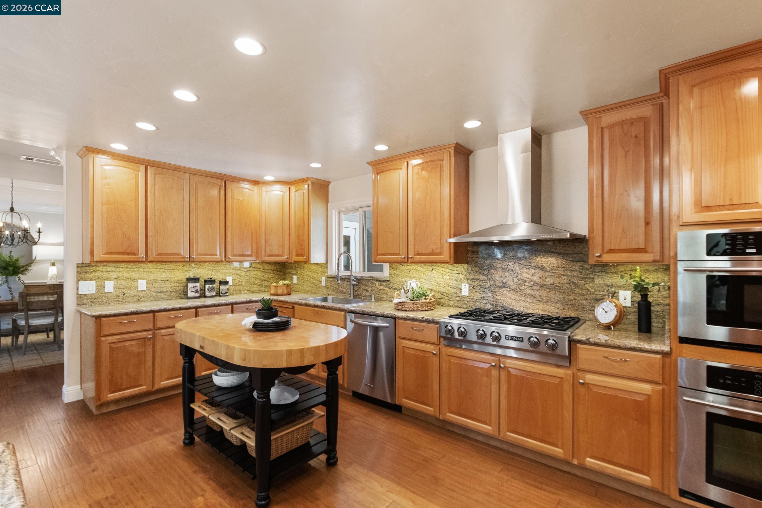 484 Diablo Road Danville, CA 94526 - Photo 14 of 39 a kitchen with a sink stove and cabinets