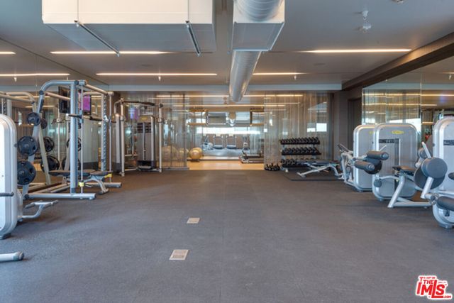 a room with lots of furniture and chandelier