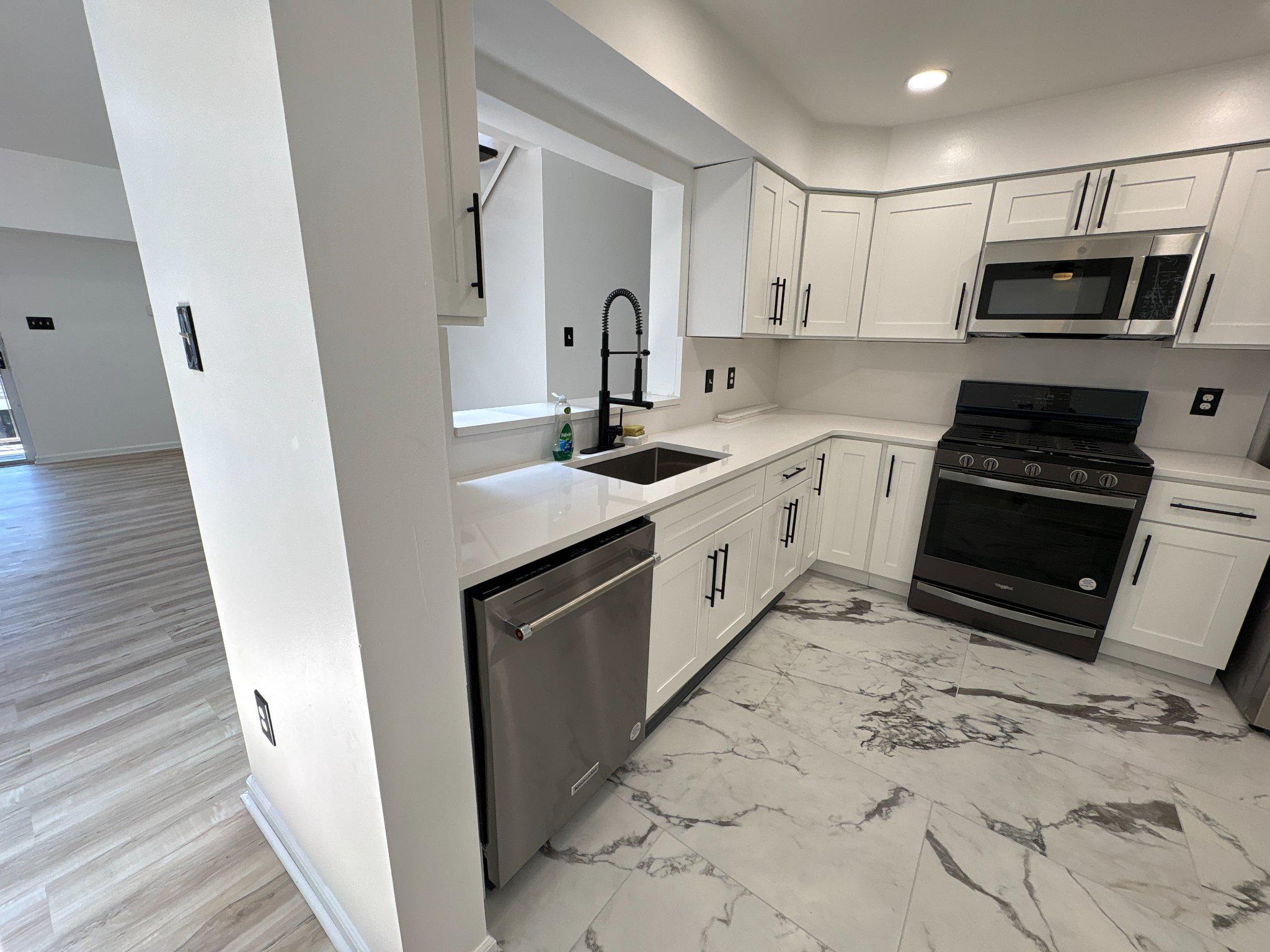 72304 Delaire Landing Road, Unit 304 Philadelphia, PA 19114 - Photo 17 of 56 Modern kitchen with sleek finishes.