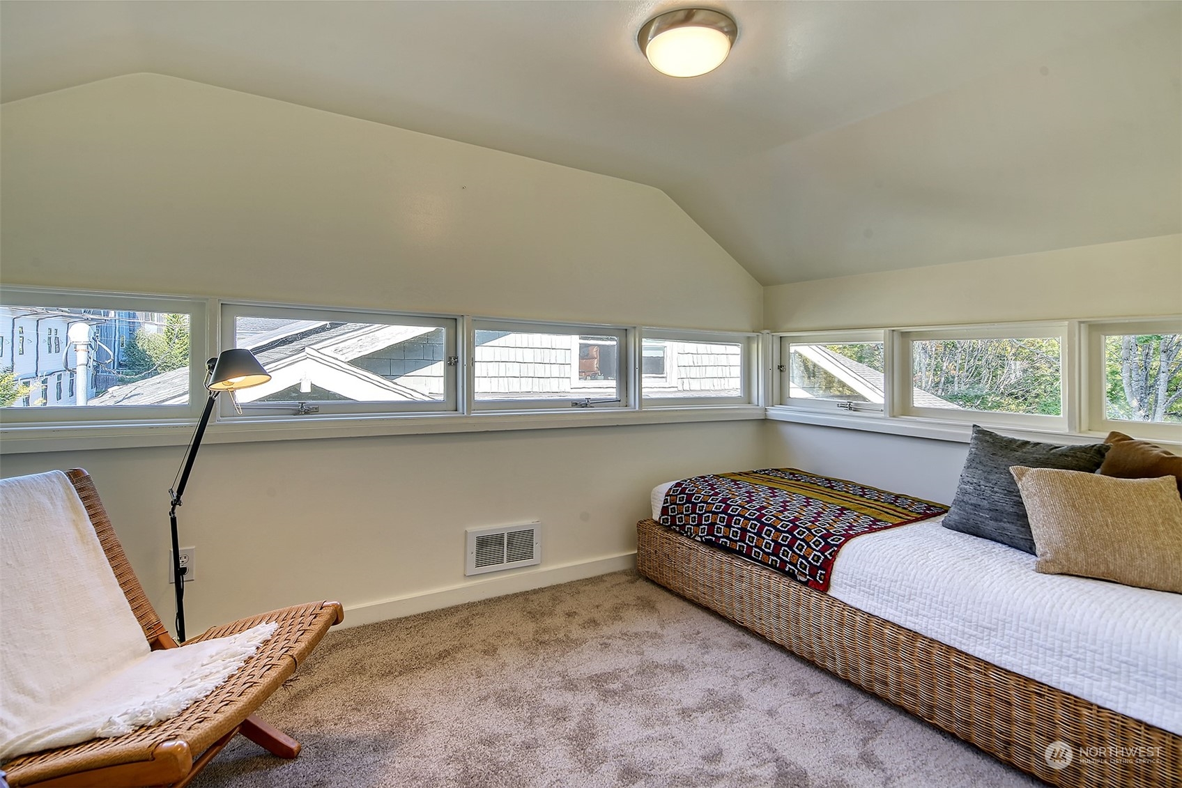 4715 Stone Way North Seattle, WA 98103 - Photo 19 of 30 a living room with furniture and a window