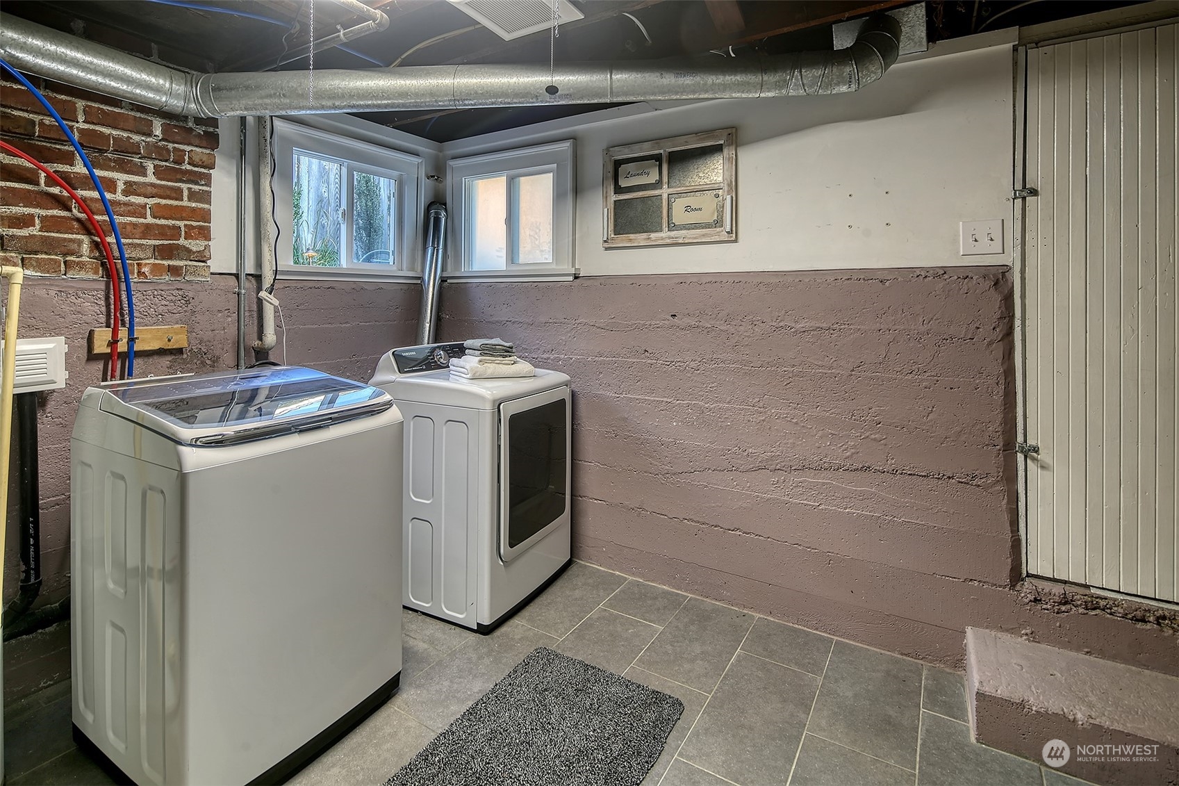 4715 Stone Way North Seattle, WA 98103 - Photo 26 of 30 a utility room with dryer and washer