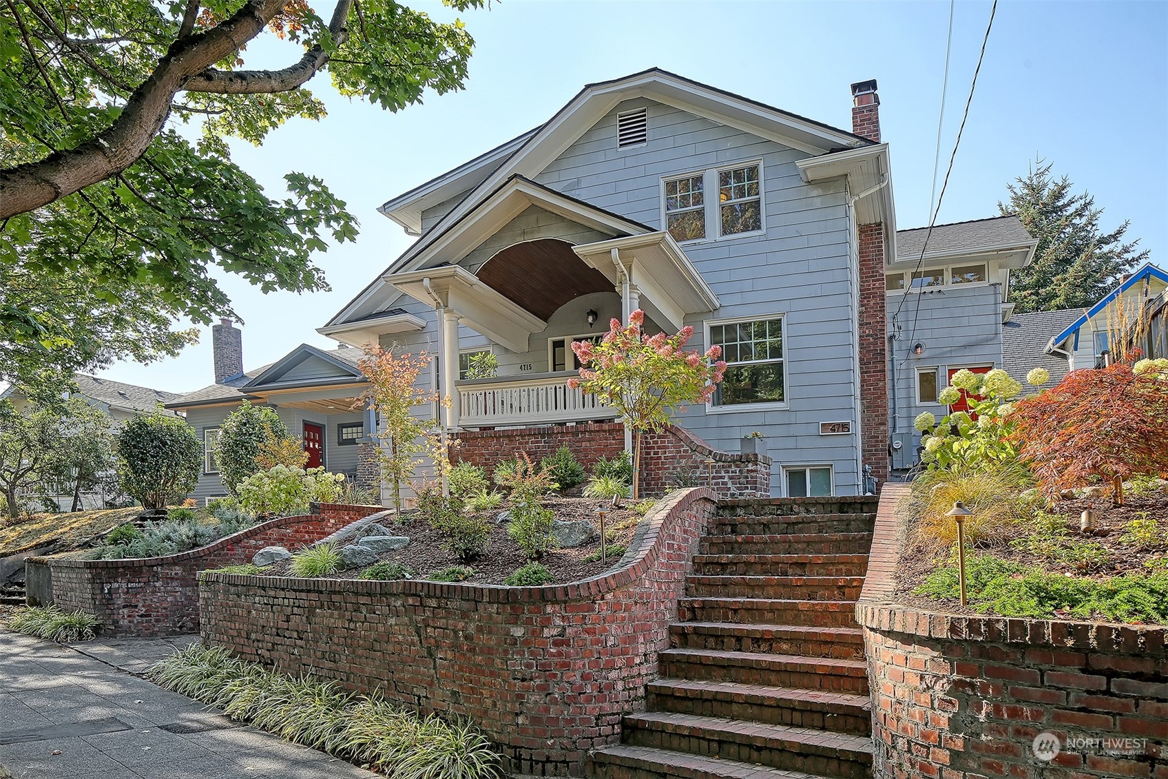 4715 Stone Way North Seattle, WA 98103 - Photo 29 of 30 a front view of a house with a yard