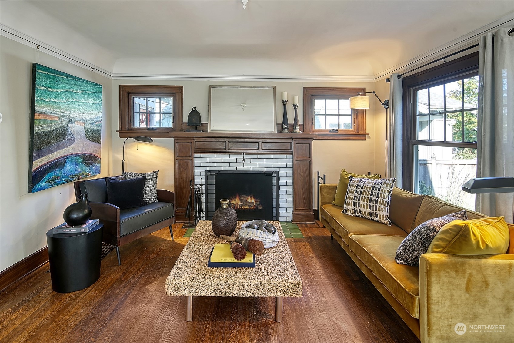 4715 Stone Way North Seattle, WA 98103 - Photo 5 of 30 a living room with furniture fireplace and a table