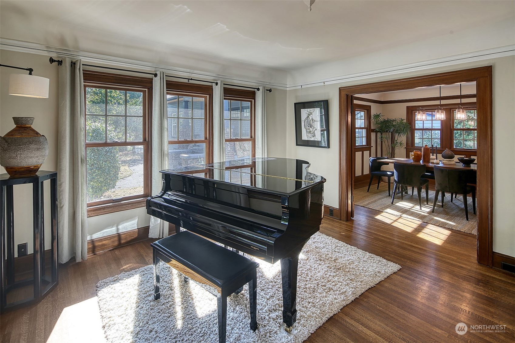 4715 Stone Way North Seattle, WA 98103 - Photo 8 of 30 a living room with furniture a wooden floor and a large window