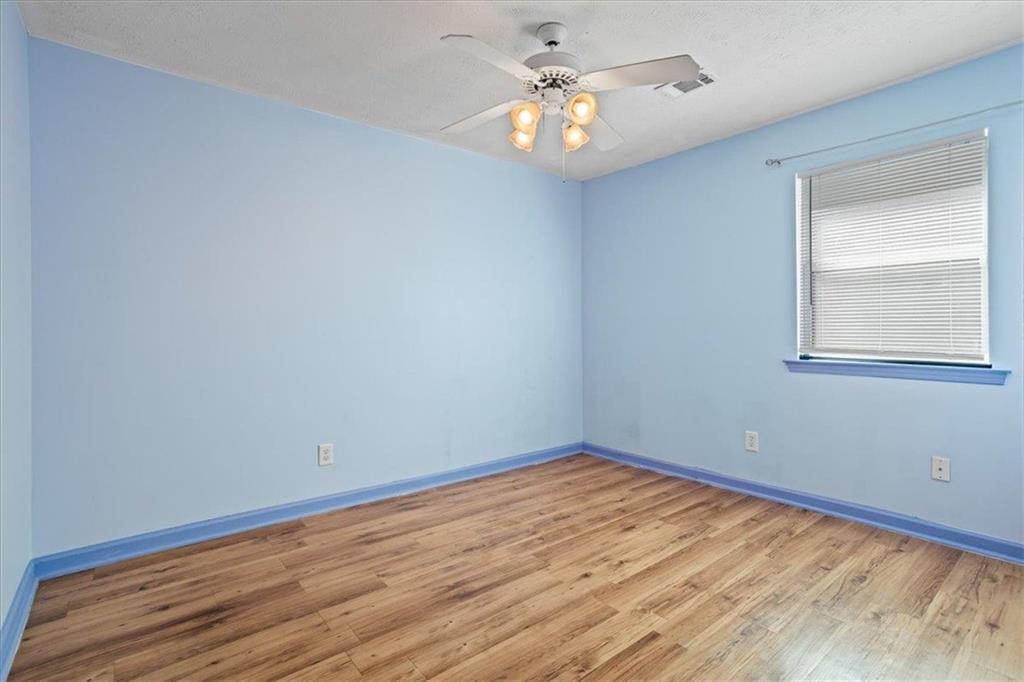 150 Crystal Brook Griffin, GA 30223 - Photo 15 of 28 wooden floor in an empty room with a window
