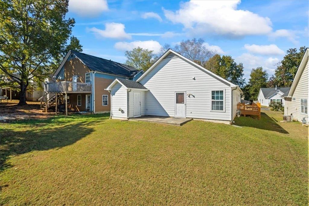 150 Crystal Brook Griffin, GA 30223 - Photo 25 of 28 a view of a house with a yard and garage