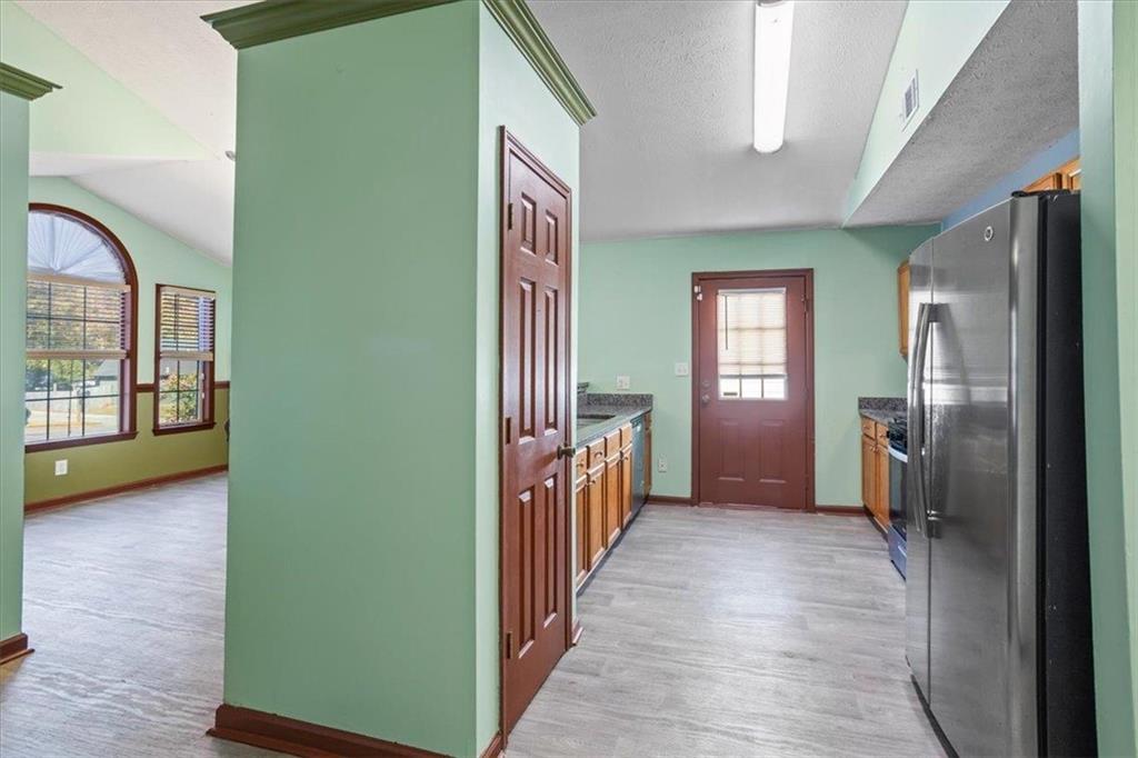 150 Crystal Brook Griffin, GA 30223 - Photo 8 of 28 a view of hallway with livingroom and stairs