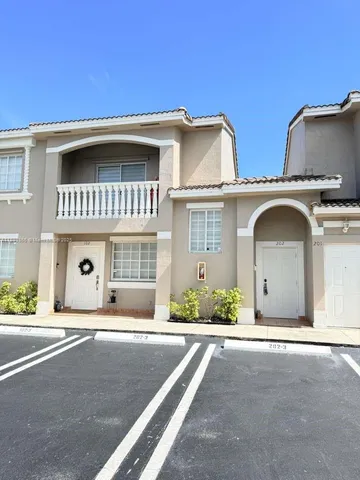 a front view of a house with a garage