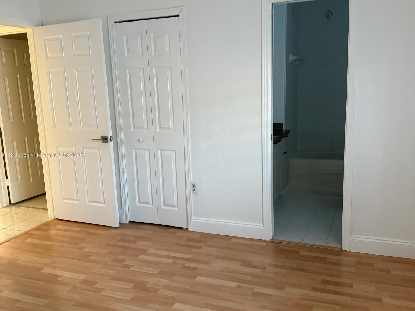 7221 Northwest 174th Terrace, Unit 202 Hialeah, FL 33015 - Photo 15 of 15 a view of entryway with wooden floor