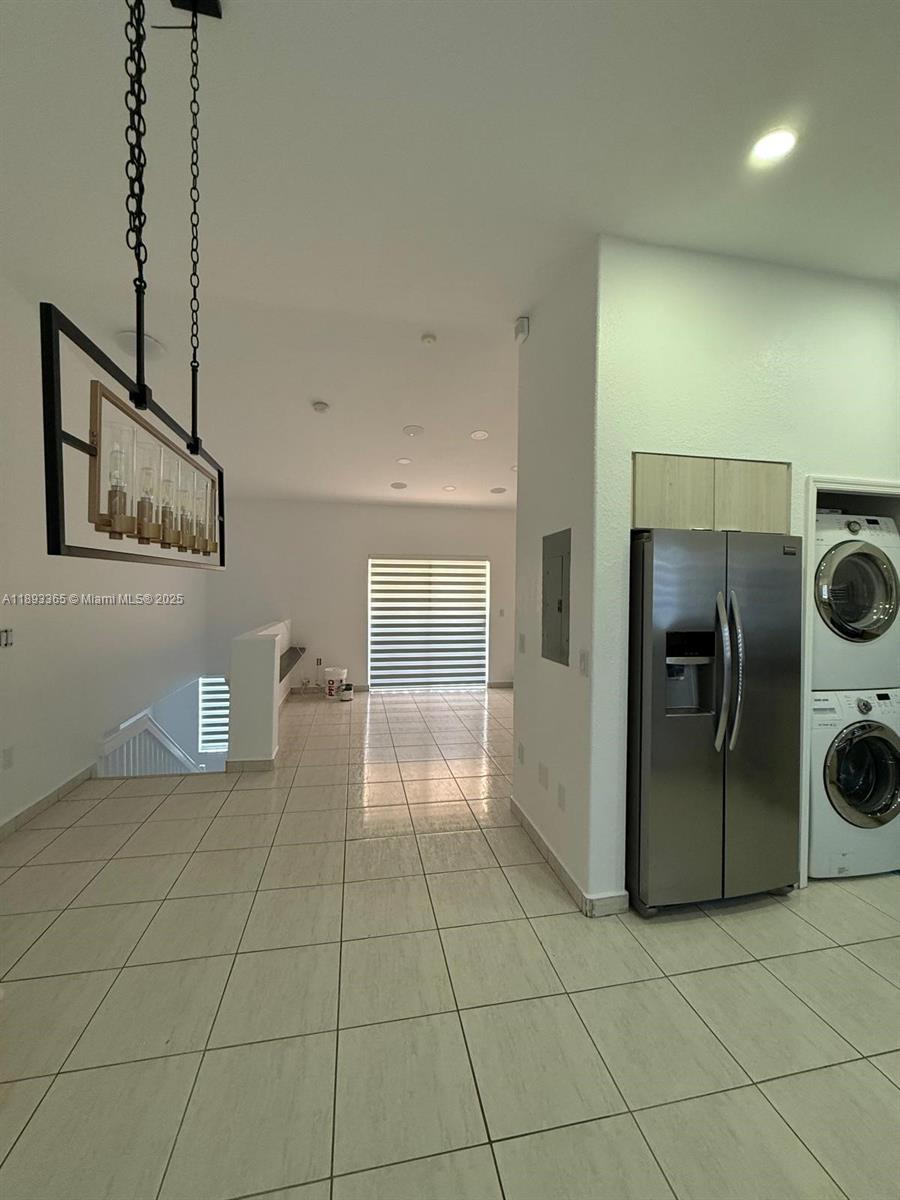 7221 Northwest 174th Terrace, Unit 202 Hialeah, FL 33015 - Photo 7 of 15 a view of a storage & utility room with two washing machine