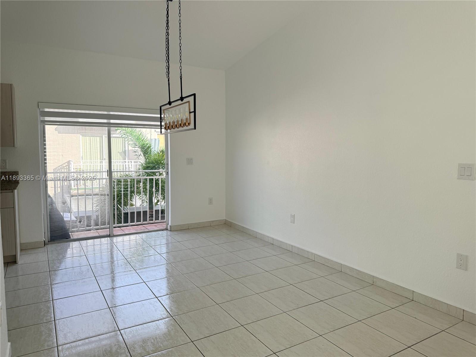 7221 Northwest 174th Terrace, Unit 202 Hialeah, FL 33015 - Photo 8 of 15 a view of a room with windows