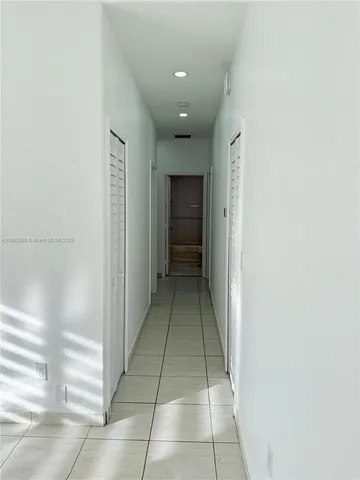a view of a hallway with a shower