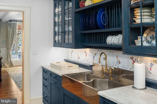 a living room with furniture a rug and a fireplace