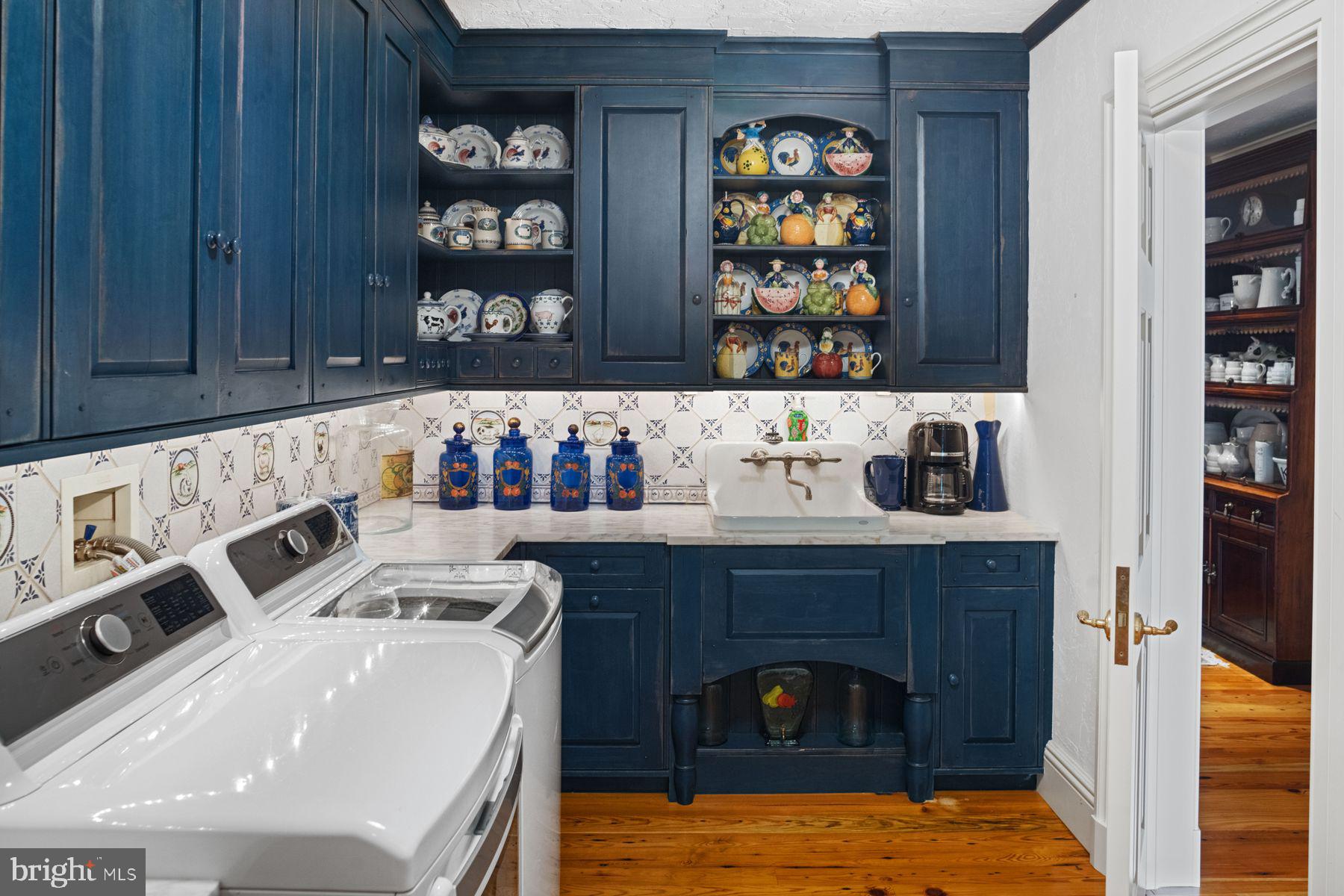 1534 North Trooper Road Norristown, PA 19403 - Photo 32 of 49 a kitchen with stainless steel appliances wooden cabinets and a table