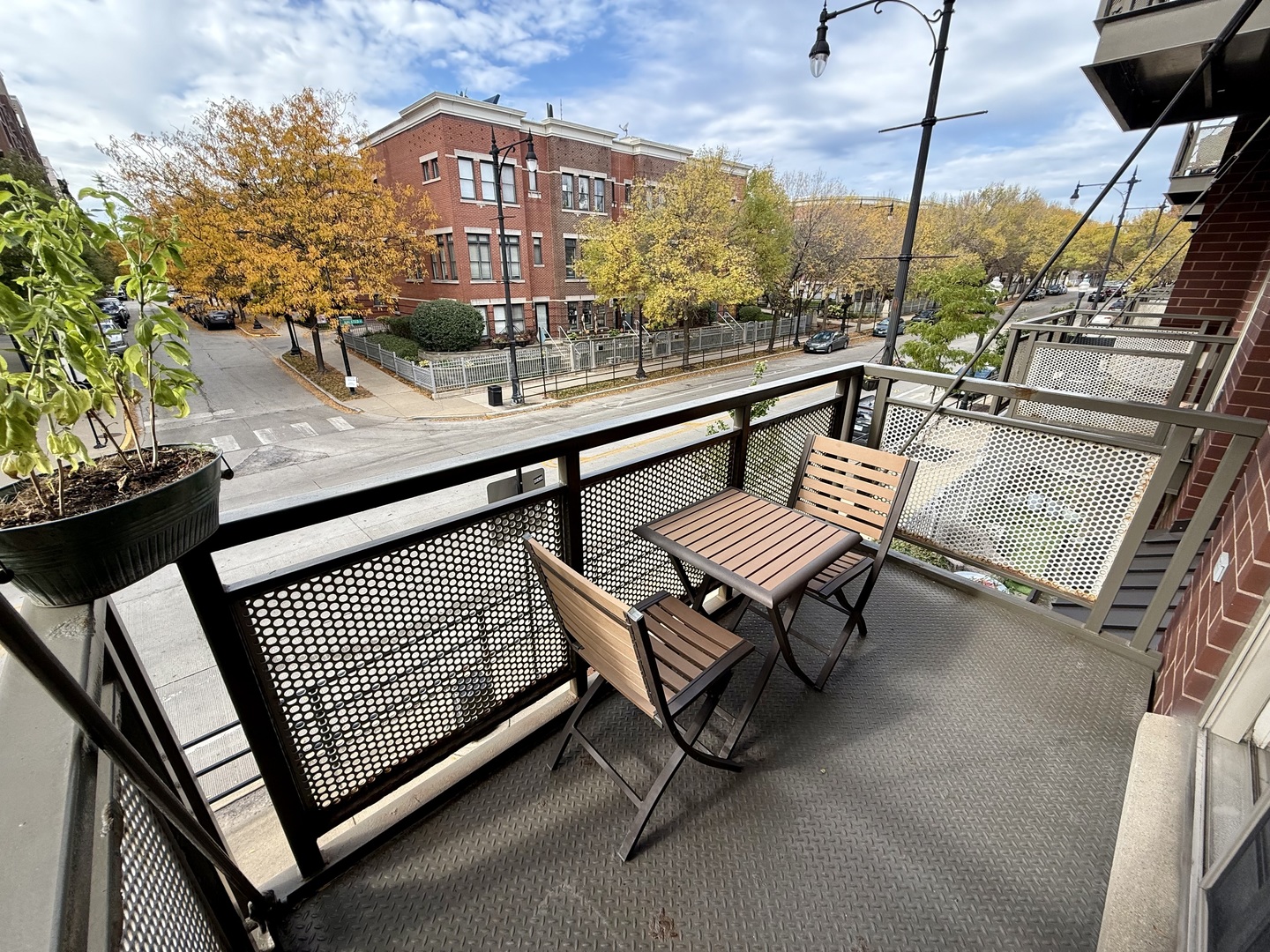 1515 South Halsted Street, Unit 204 Chicago, IL 60607 - Photo 13 of 14 a roof deck with a bench and a potted plant