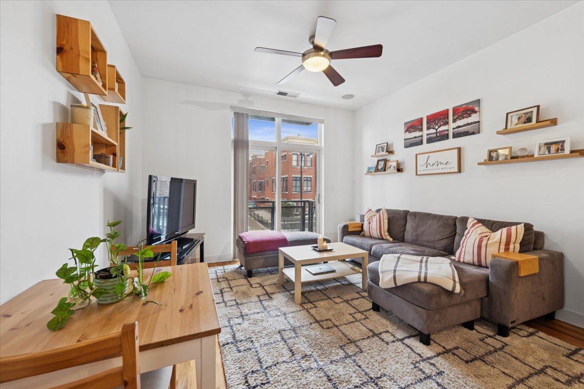 1515 South Halsted Street, Unit 204 Chicago, IL 60607 - Photo 4 of 14 a living room with furniture and a window