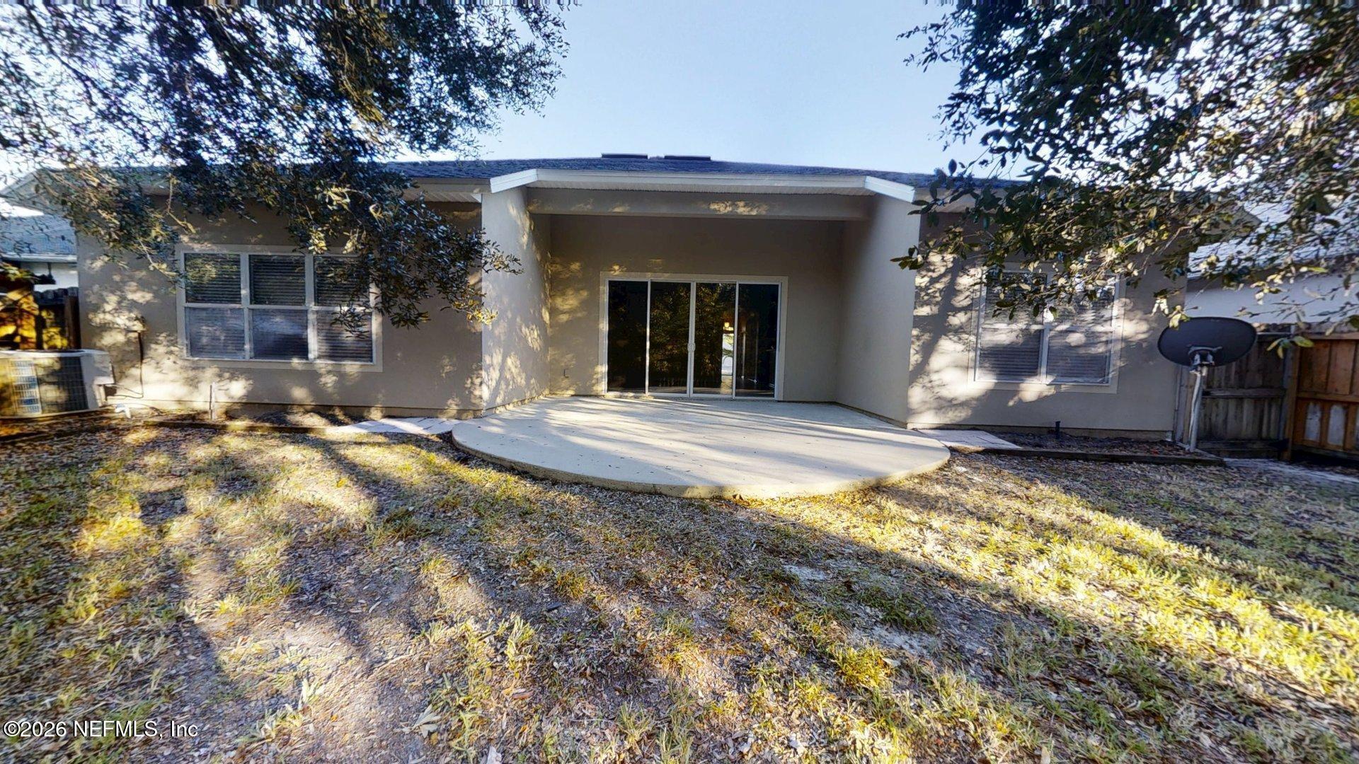 14454 Millhopper Road Jacksonville, FL 32258 - Photo 41 of 44 a view of a house with a yard