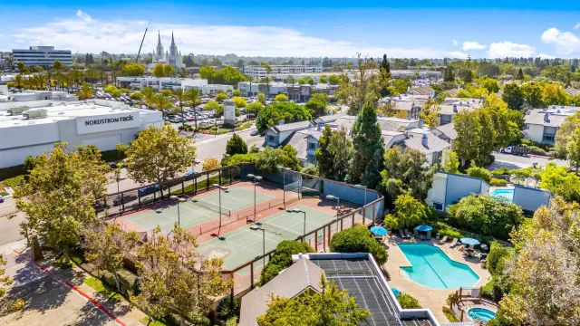 an aerial view of residential houses with outdoor space