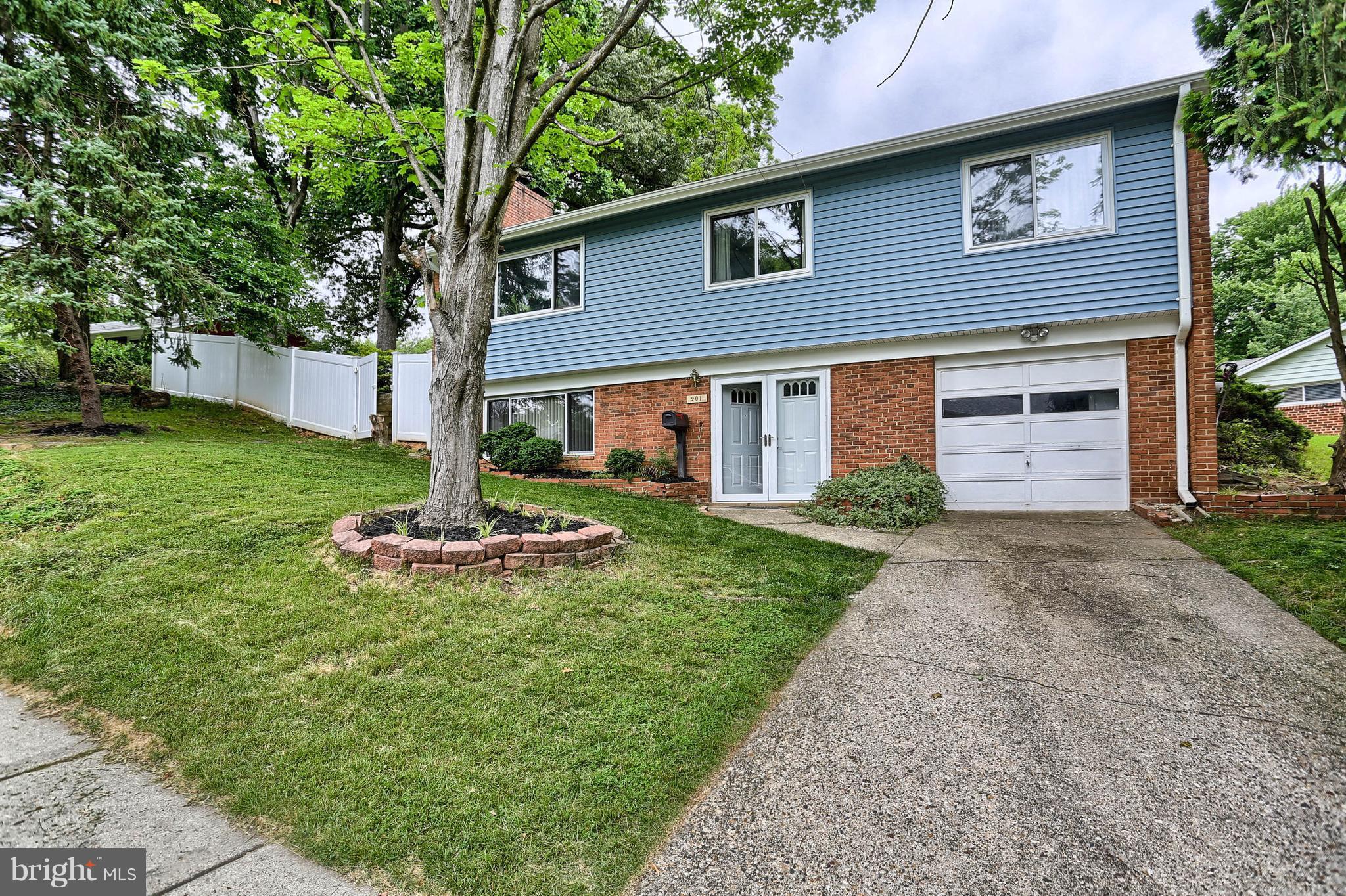 201 Belton Road Silver Spring, MD 20901 - Photo 1 of 24 a view of a house with backyard and garden