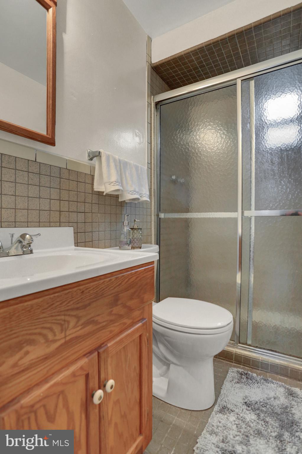 201 Belton Road Silver Spring, MD 20901 - Photo 14 of 24 a bathroom with a sink toilet and shower