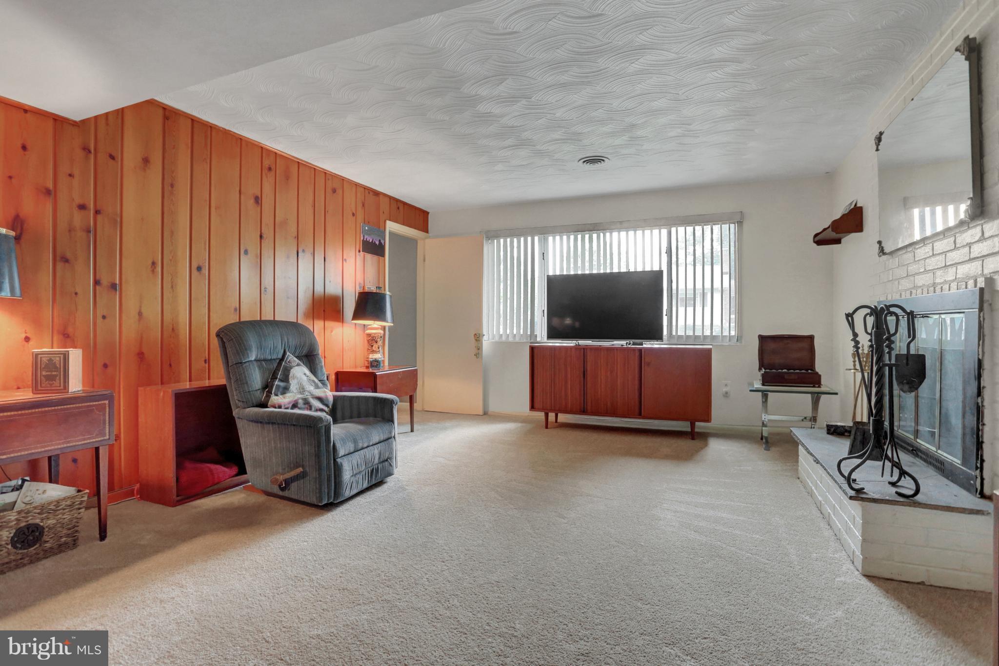 201 Belton Road Silver Spring, MD 20901 - Photo 15 of 24 a living room with furniture and a flat screen tv