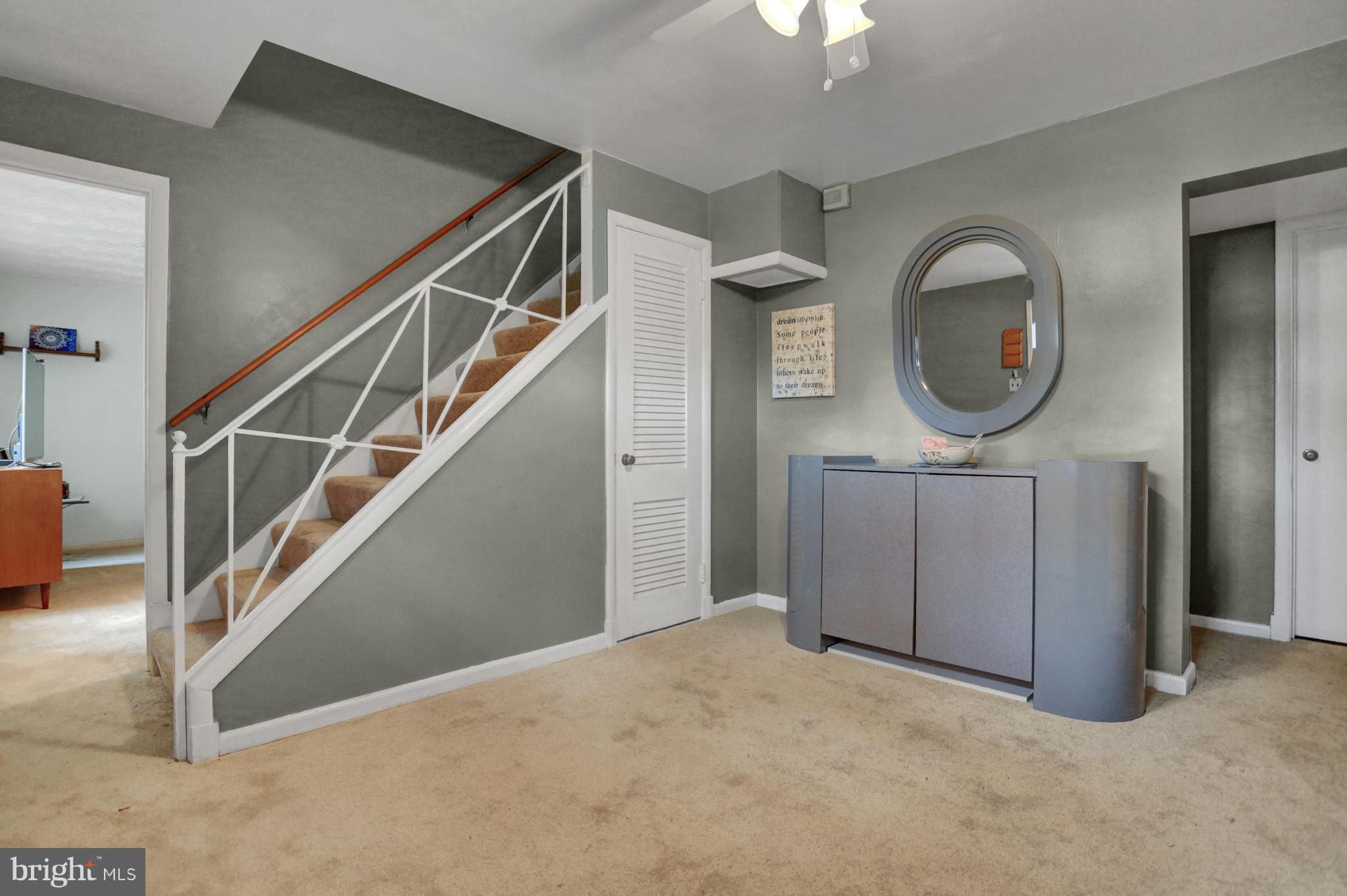 201 Belton Road Silver Spring, MD 20901 - Photo 3 of 24 a view of a hallway with entryway wooden floor and cabinet