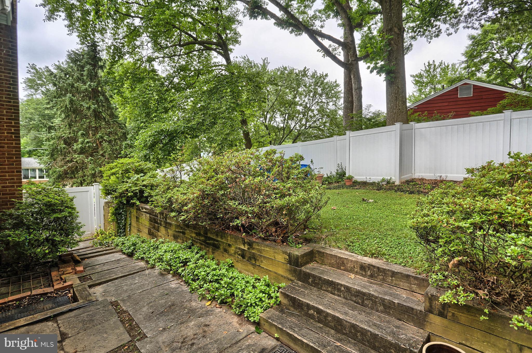 201 Belton Road Silver Spring, MD 20901 - Photo 24 of 24 a backyard of a white house with lots of green space