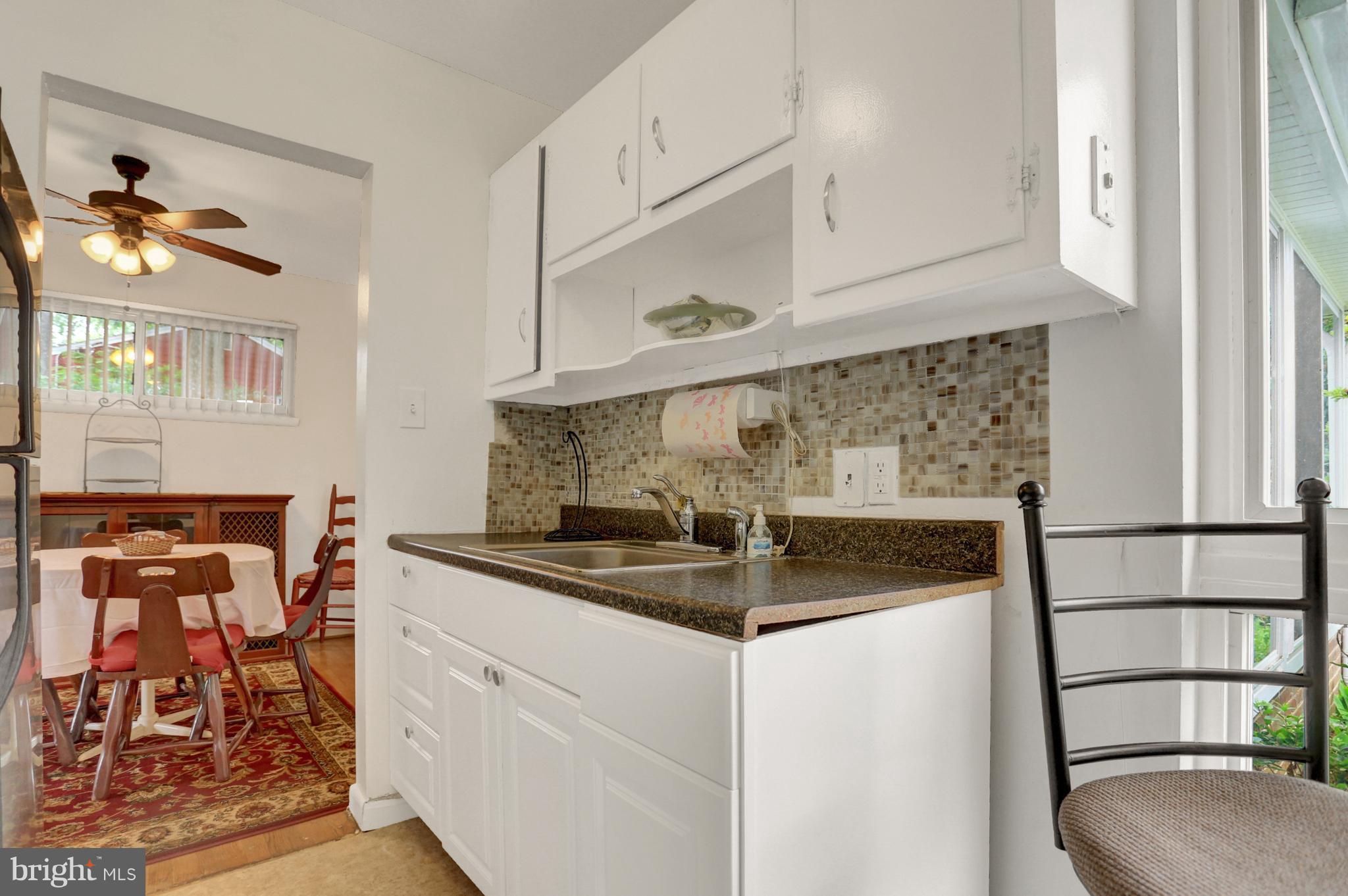 201 Belton Road Silver Spring, MD 20901 - Photo 7 of 24 a kitchen with stainless steel appliances granite countertop a sink stove and cabinets