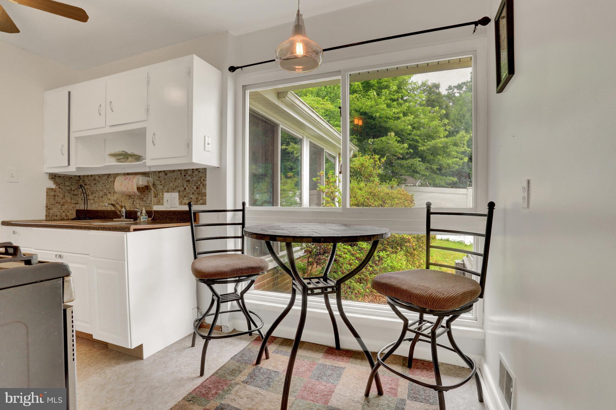 201 Belton Road Silver Spring, MD 20901 - Photo 9 of 24 a view of a dining room with furniture window and outside view