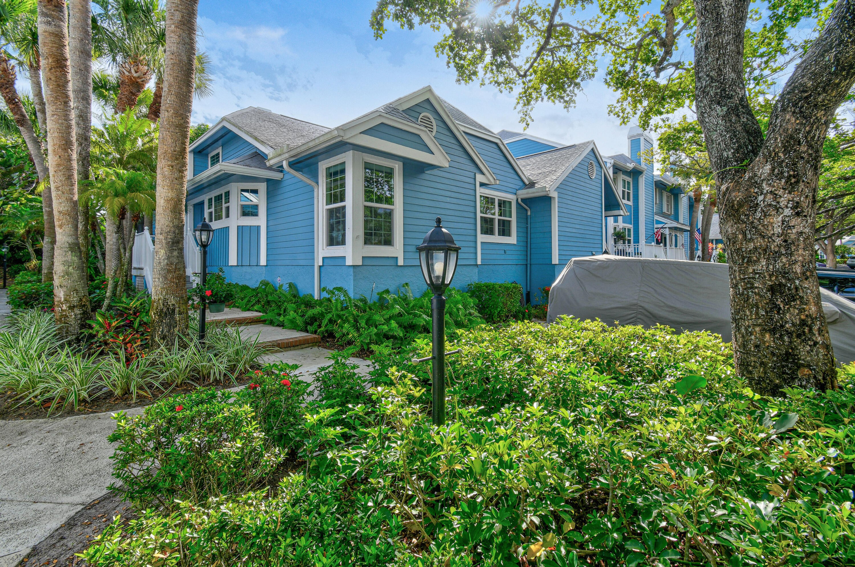 607 Ocean Dunes Circle Jupiter, FL 33477 - Photo 1 of 45 front view of a house with a yard