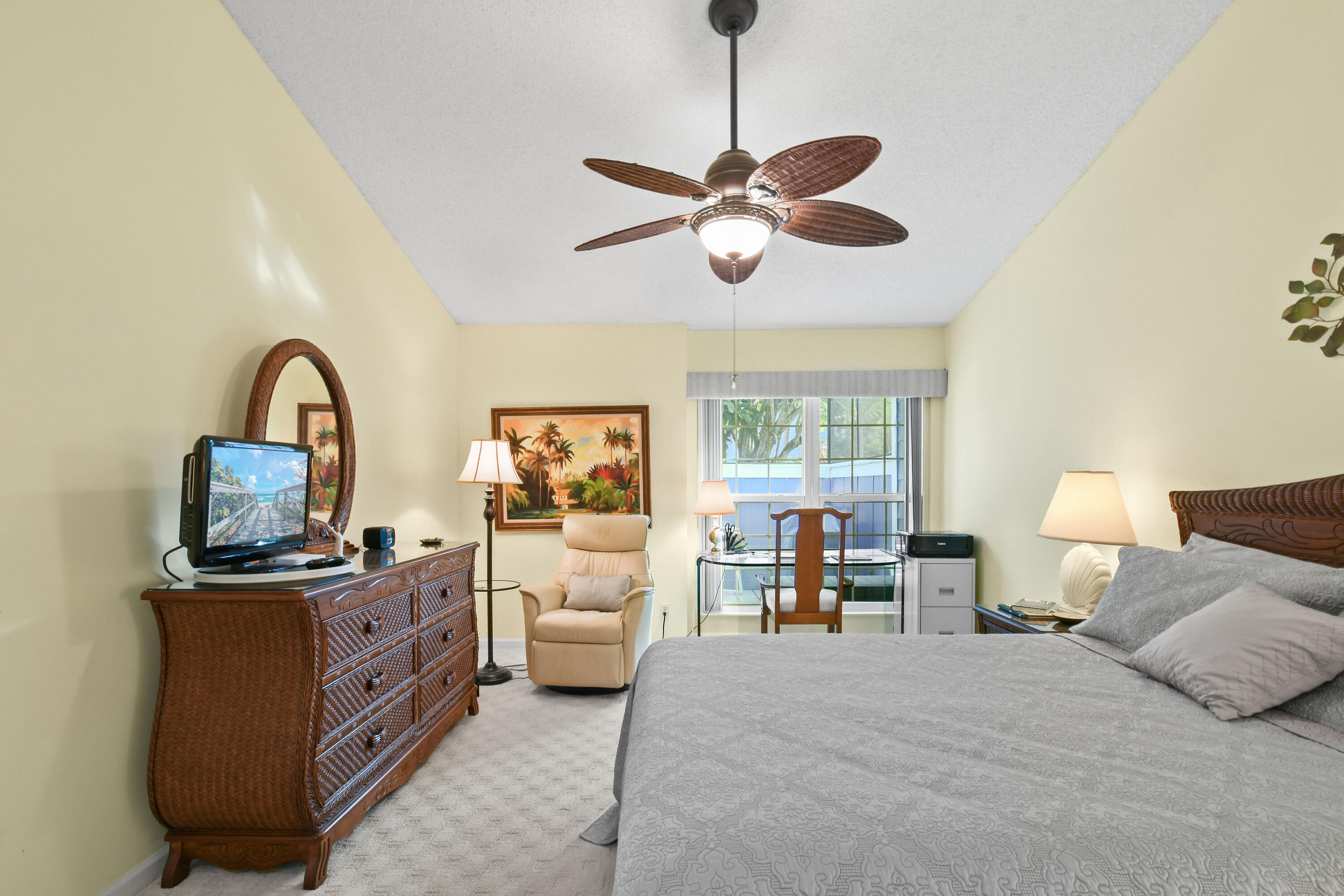 607 Ocean Dunes Circle Jupiter, FL 33477 - Photo 13 of 45 a bedroom with a bed wooden floor and furniture