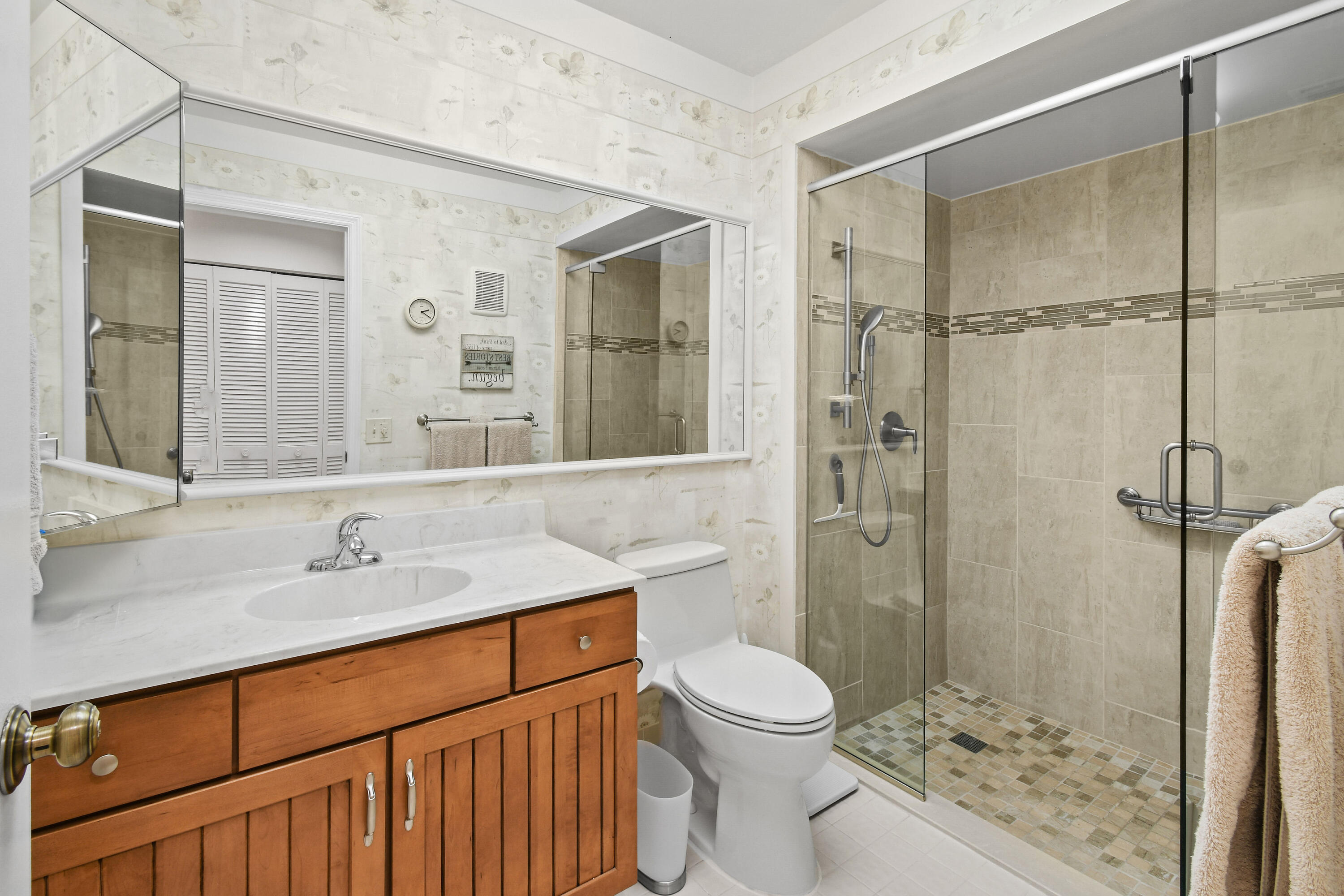 607 Ocean Dunes Circle Jupiter, FL 33477 - Photo 15 of 45 a bathroom with a sink toilet and shower