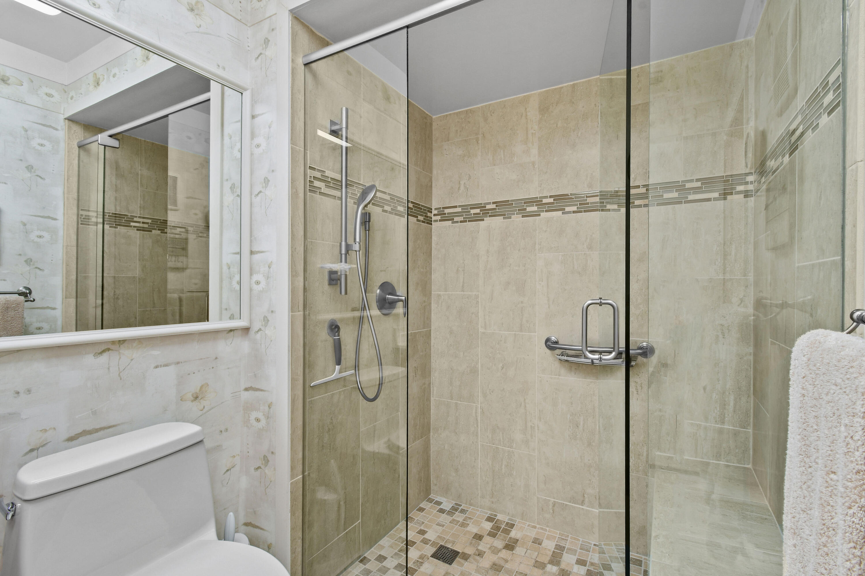 607 Ocean Dunes Circle Jupiter, FL 33477 - Photo 16 of 45 a bathroom with a shower and toilet