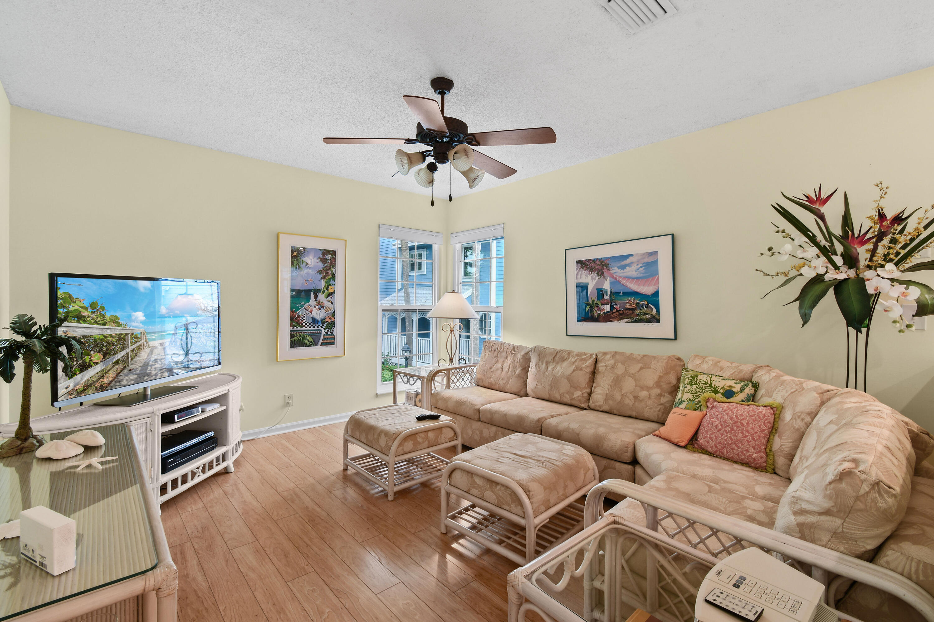 607 Ocean Dunes Circle Jupiter, FL 33477 - Photo 17 of 45 a living room with furniture a flat screen tv and a potted plant