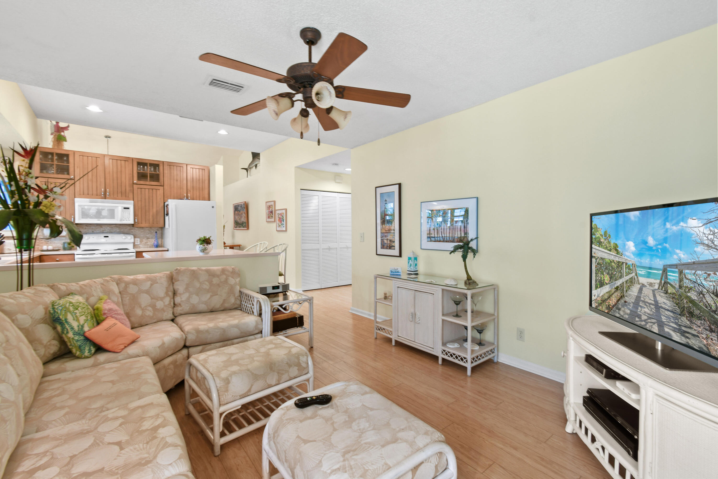 607 Ocean Dunes Circle Jupiter, FL 33477 - Photo 18 of 45 a living room with furniture and a wooden floor