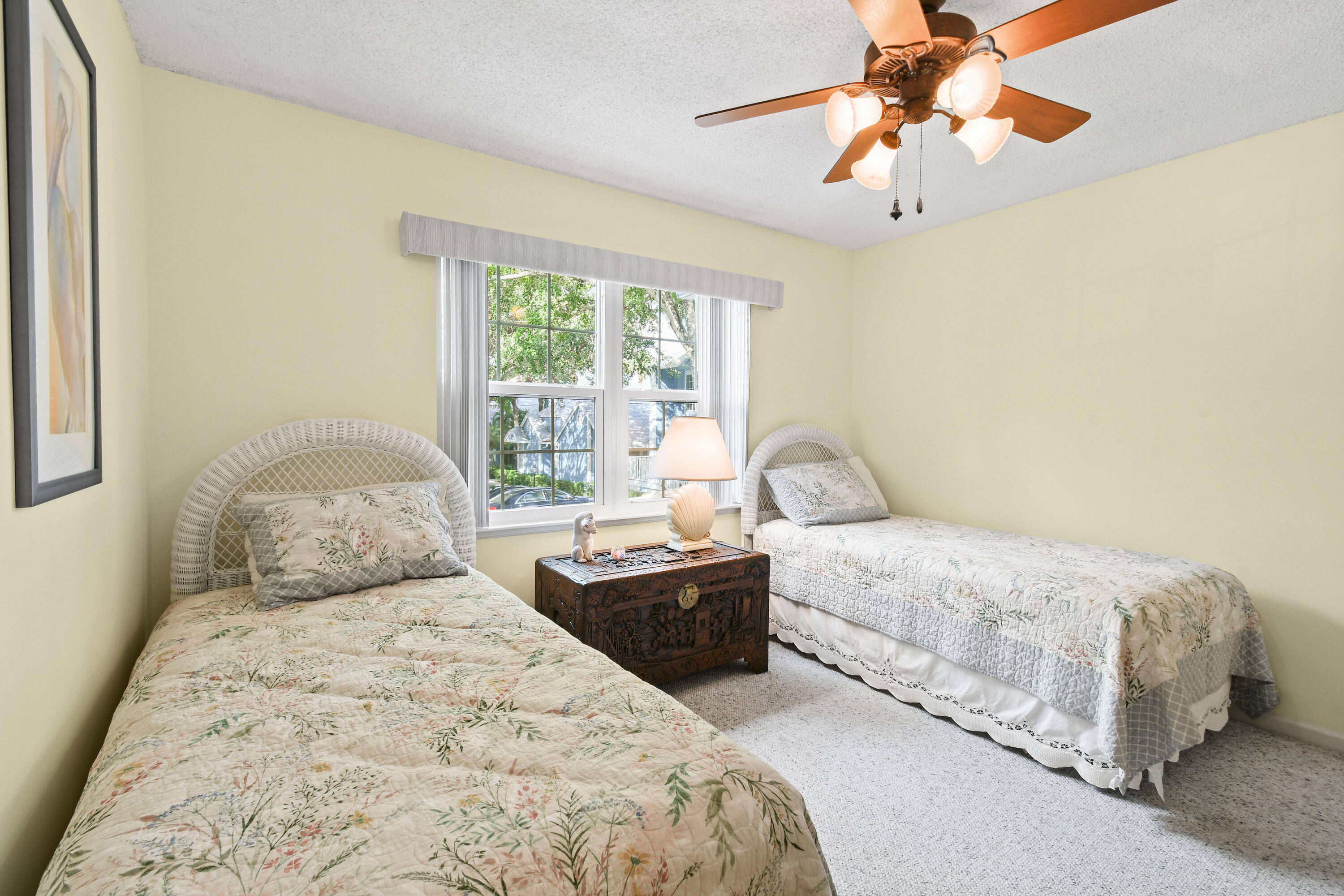 607 Ocean Dunes Circle Jupiter, FL 33477 - Photo 20 of 45 a bedroom with a bed and a chandelier