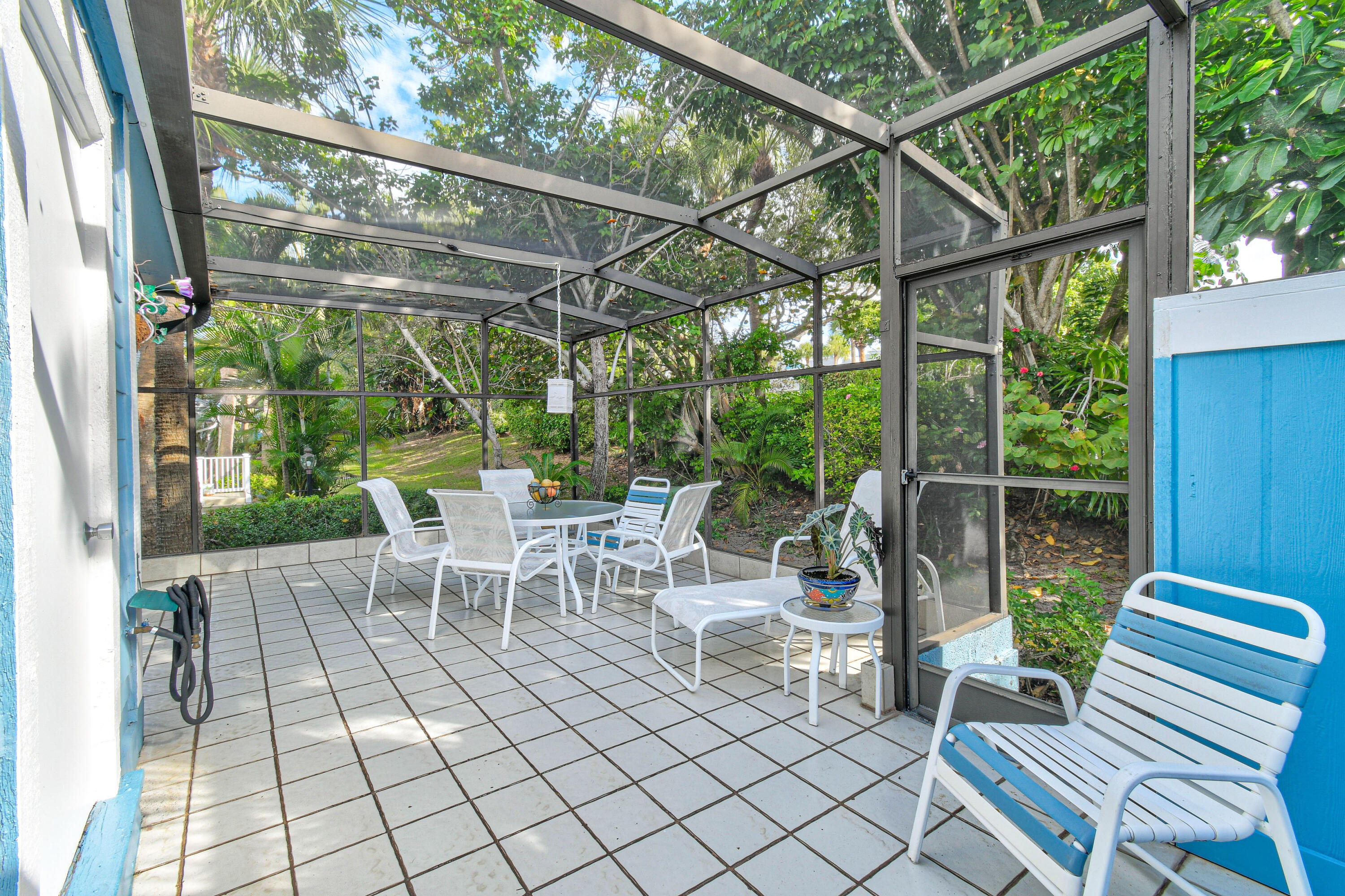 607 Ocean Dunes Circle Jupiter, FL 33477 - Photo 26 of 45 a view of a porch with chairs and backyard