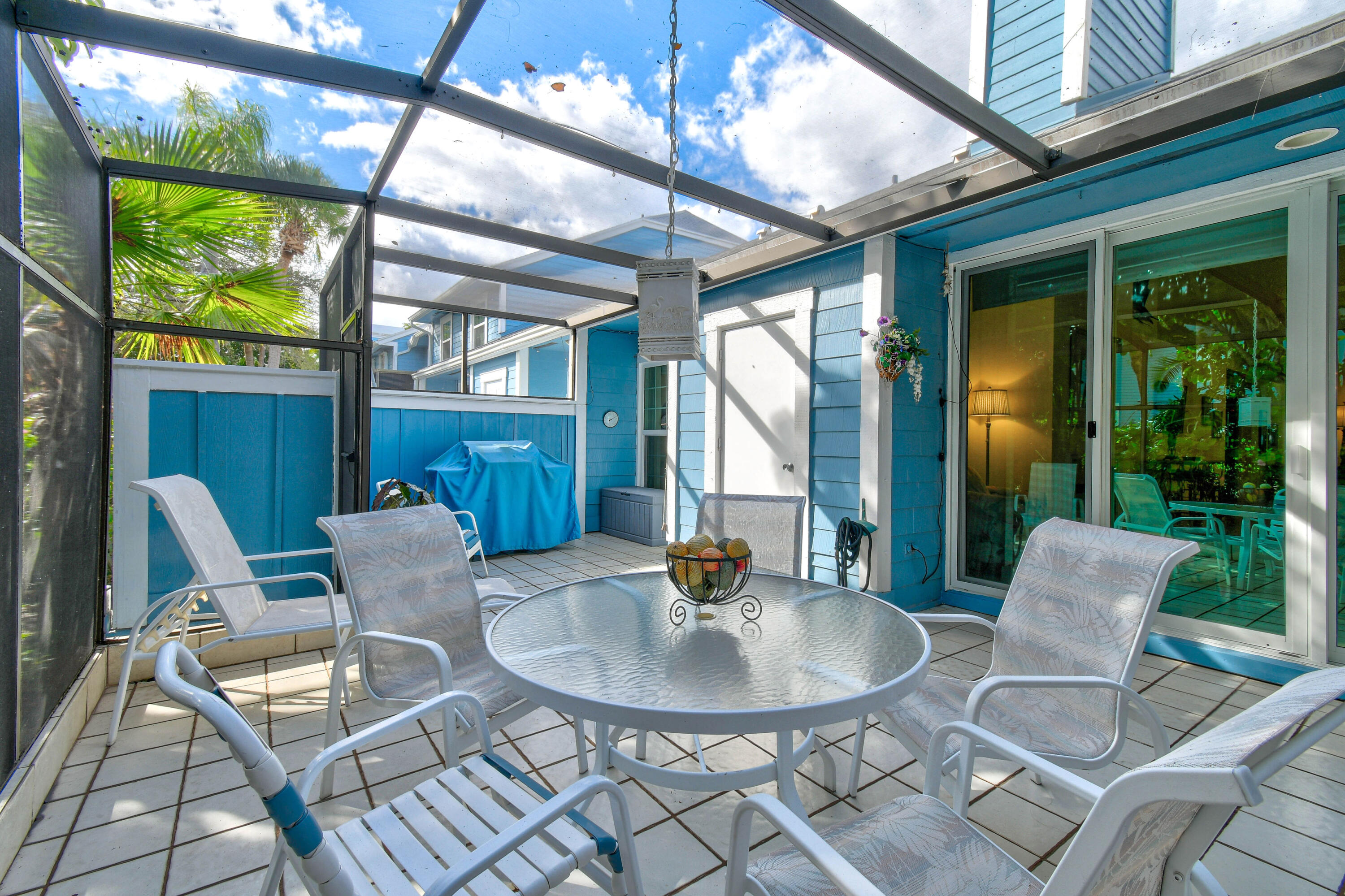 607 Ocean Dunes Circle Jupiter, FL 33477 - Photo 28 of 45 a patio with a table and chairs