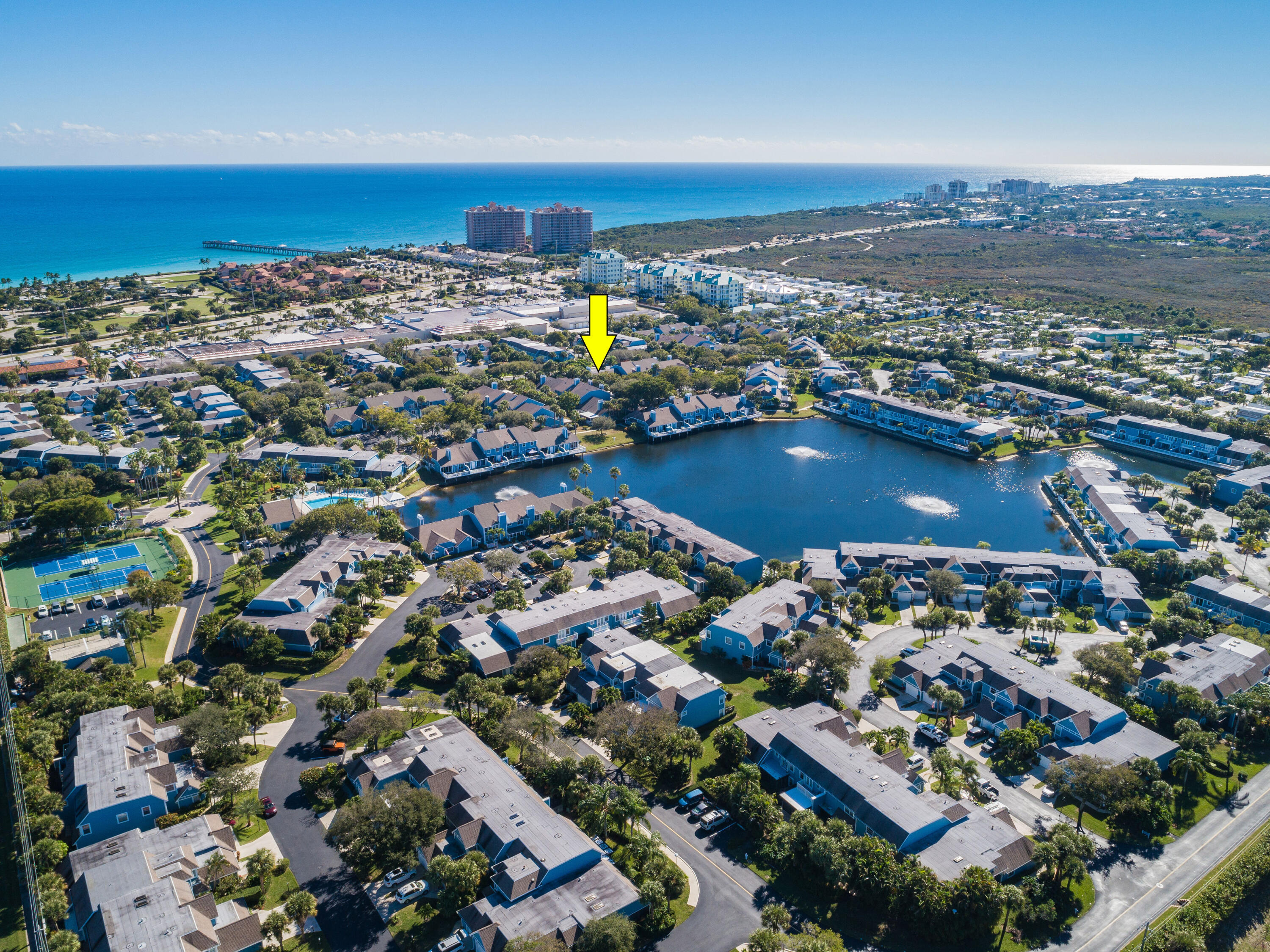 607 Ocean Dunes Circle Jupiter, FL 33477 - Photo 31 of 45 an aerial view of residential houses with outdoor space
