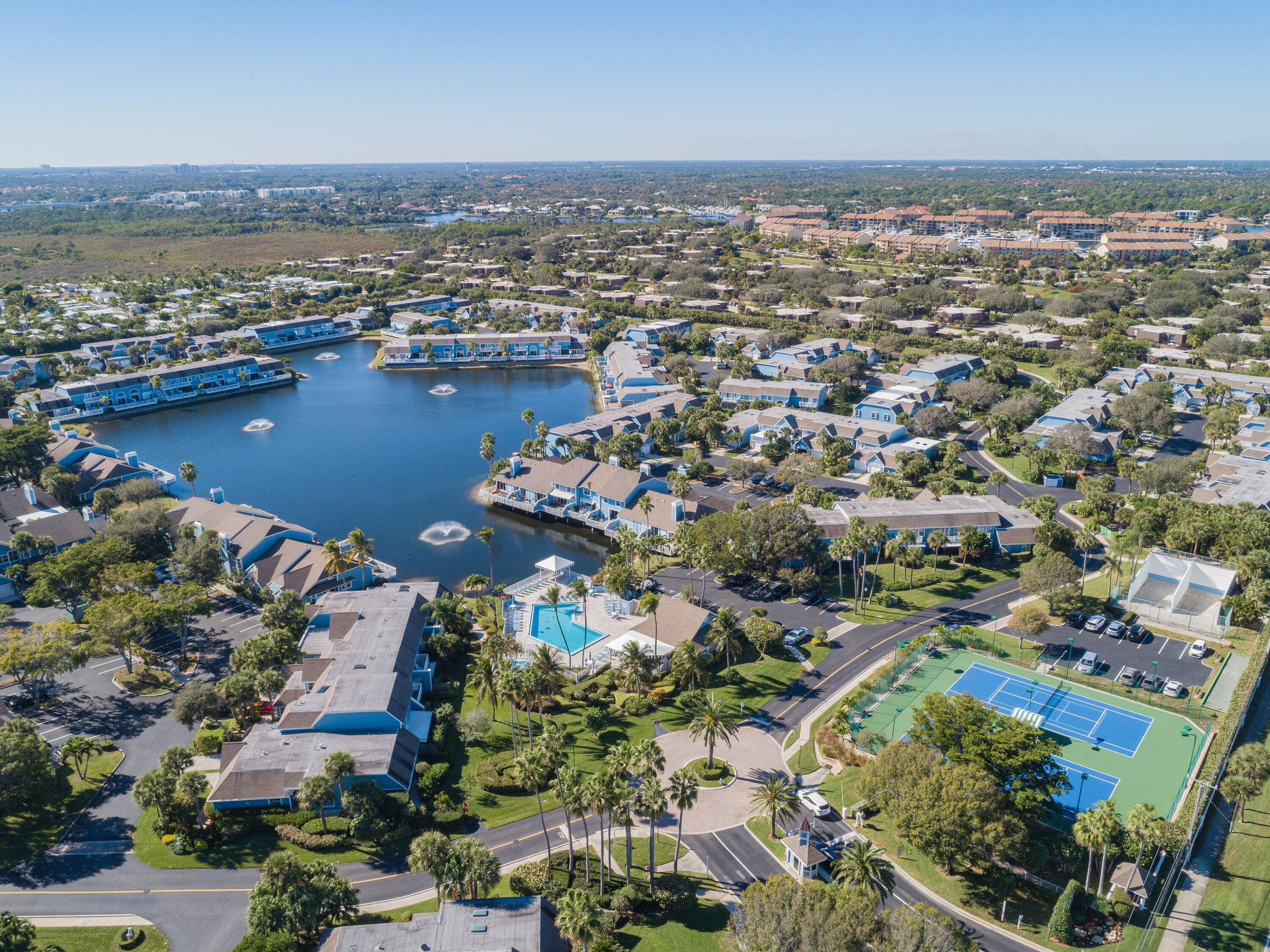 607 Ocean Dunes Circle Jupiter, FL 33477 - Photo 32 of 45 an aerial view of a city with lots of residential buildings