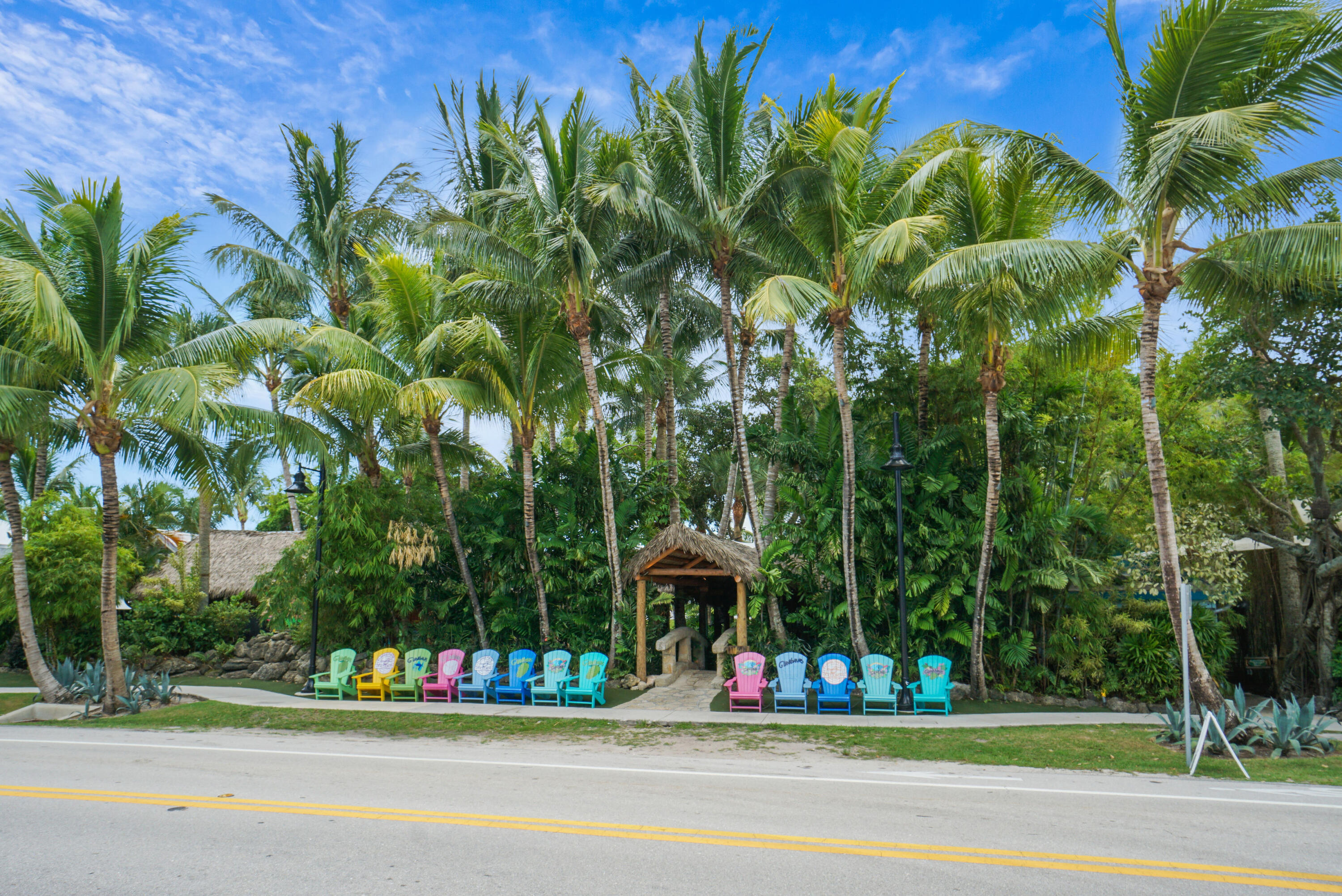 607 Ocean Dunes Circle Jupiter, FL 33477 - Photo 43 of 45 a view of a fountain in a yard with plants and palm trees