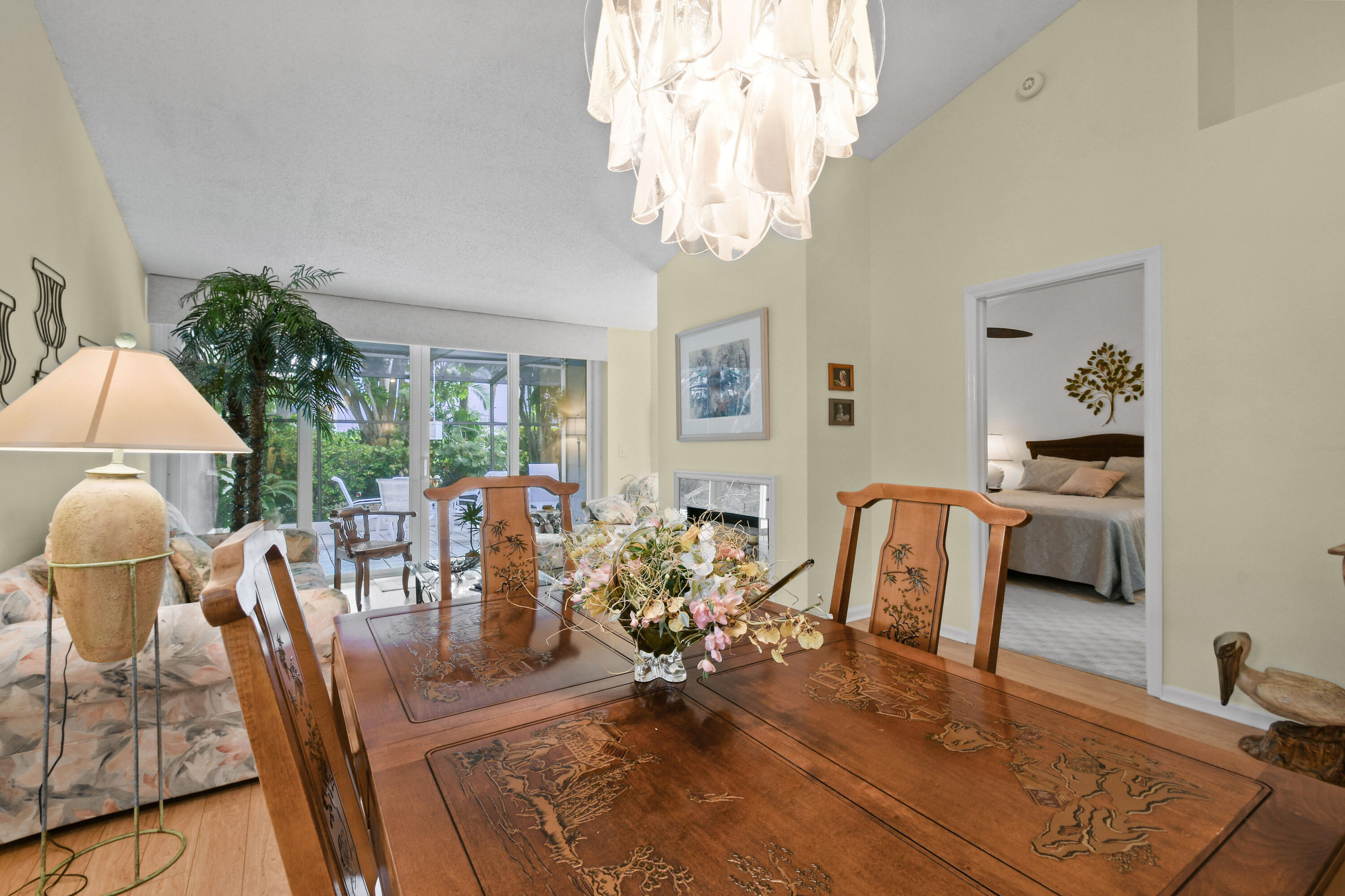607 Ocean Dunes Circle Jupiter, FL 33477 - Photo 6 of 45 a view of a dining room with furniture a chandelier and wooden floor