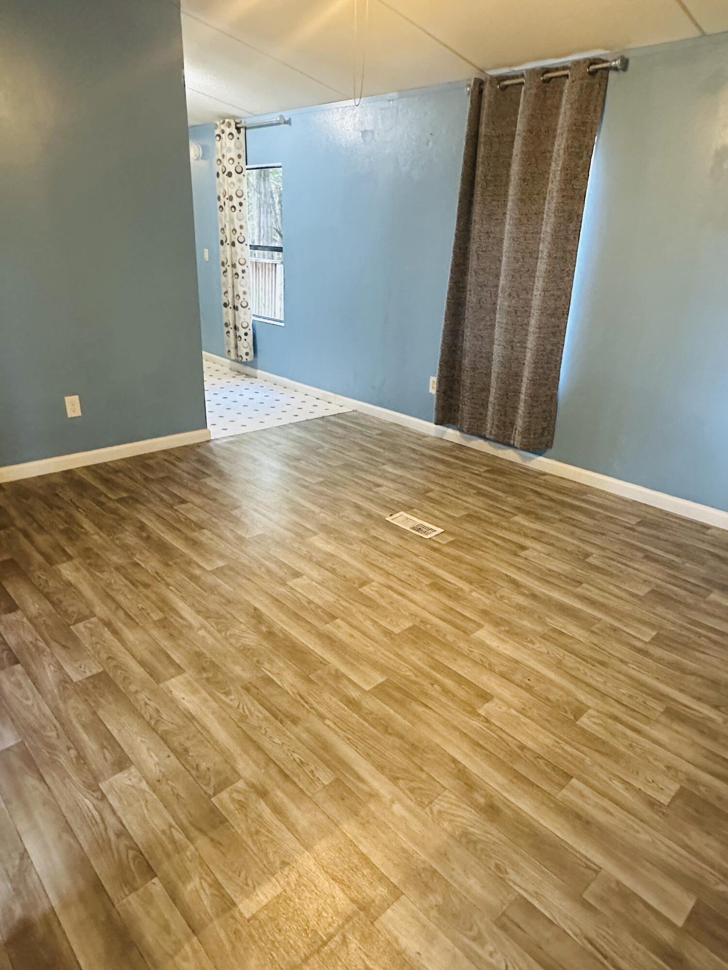 1980 Williams Ditch Road Cantonment, FL 32533 - Photo 2 of 18 a view of an empty room with wooden floor