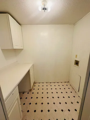 a bathroom with a sink a vanity and a shower