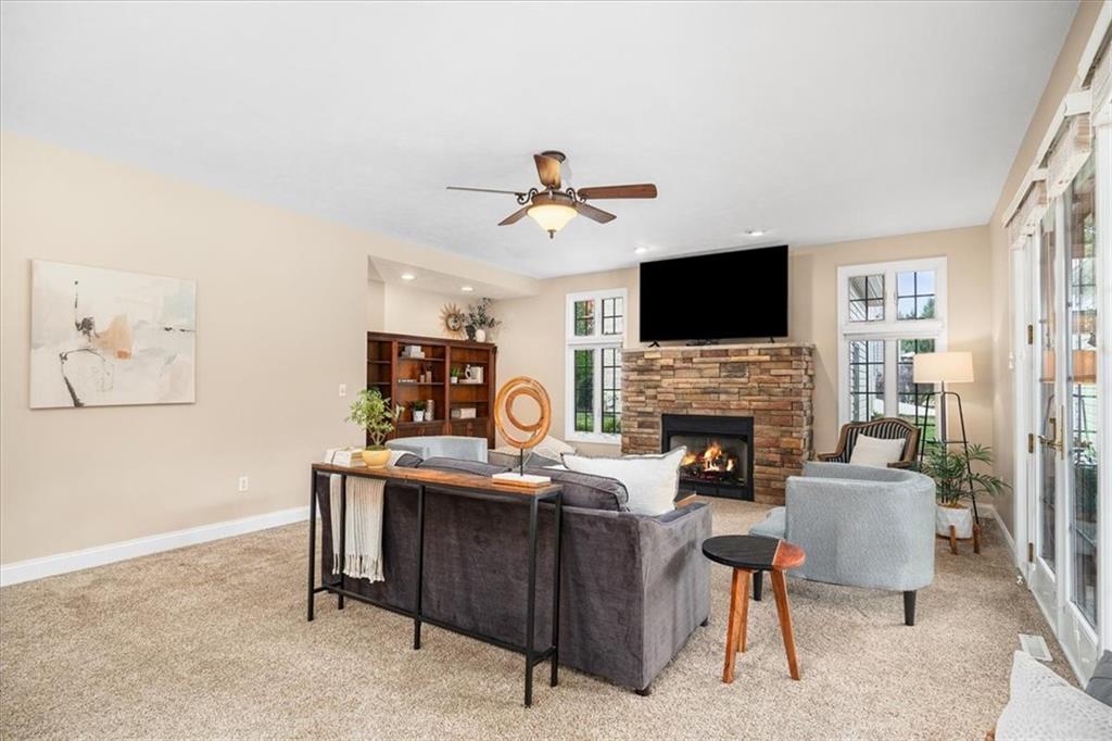 185 Pinkerton Road Wexford, PA 15090 - Photo 13 of 40 a living room with furniture a fireplace and a flat screen tv