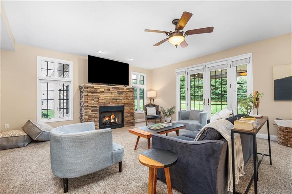 185 Pinkerton Road Wexford, PA 15090 - Photo 16 of 40 a living room with furniture fireplace and a flat screen tv