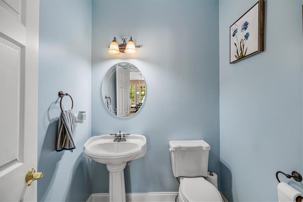 185 Pinkerton Road Wexford, PA 15090 - Photo 17 of 40 a bathroom with a sink mirror and toilet