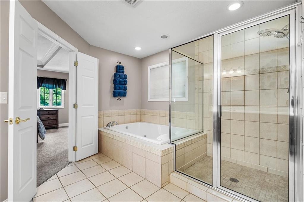 185 Pinkerton Road Wexford, PA 15090 - Photo 19 of 40 a bathroom with a tub and a shower